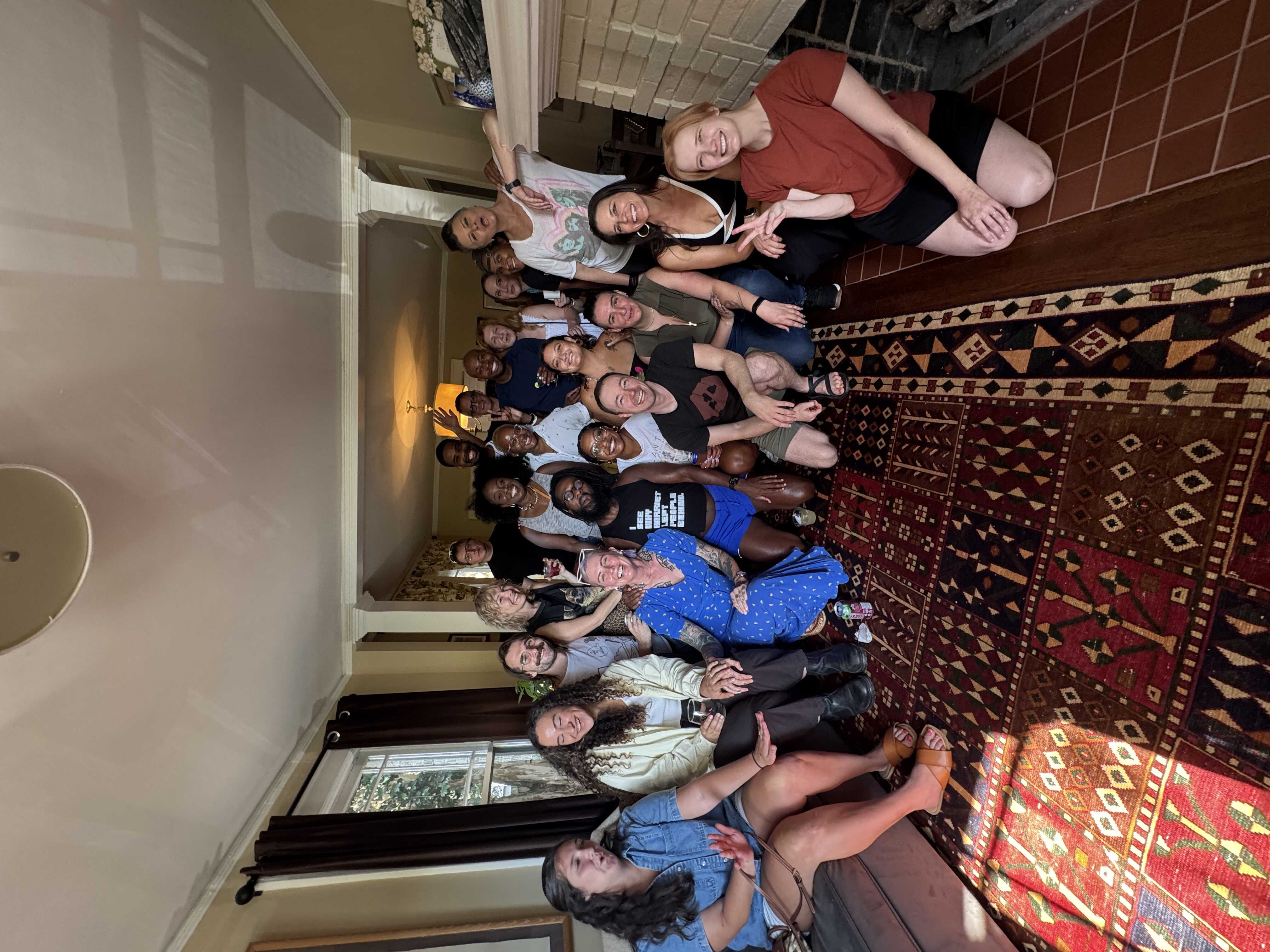 two dozen beautiful people stuffed in a tiny room
